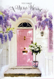 In this tranquil Crouch End doorway scene, everything seems to pause for a moment of soft, floral joy. A gently blushed pink front door, smooth and freshly painted, stands out against a backdrop of whitewashed walls that catch the light like a calm morning along Park Road. The door's pastel tone is mirrored by a single shutter, adding balance and repeating the warm, rosy hue. Overhead, wisteria spills luxuriously from above the frame, its flowers hanging in cascades of lavender and lilac, each tiny bloom forming part of a sweeping curtain that frames the entrance. The wisteria's winding branches and delicate leaves create patterns of shade and light on the wall, giving the impression of a living, breathing canopy. Resting on the stone step, close to the threshold, is a simple grey metal bucket filled with an abundant arrangement of white and cream roses. The roses are lush and fully textured, their petals opening in layered swirls that invite the eye to linger, while loose stems of soft green foliage weave between them, adding contrast and a hint of movement. A pale pink ribbon encircles the bucket, tied in a modest yet elegant bow that echoes the tone of the door and unifies the colour story. The overall feeling is one of gentle celebration, as though this is the first day in a new N8 address and this bouquet has been delivered as a quiet but heartfelt housewarming gift. You can almost sense the mingled fragrance of roses and wisteria drifting into the hallway as the door begins to open, marking the start of many happy moments to come.